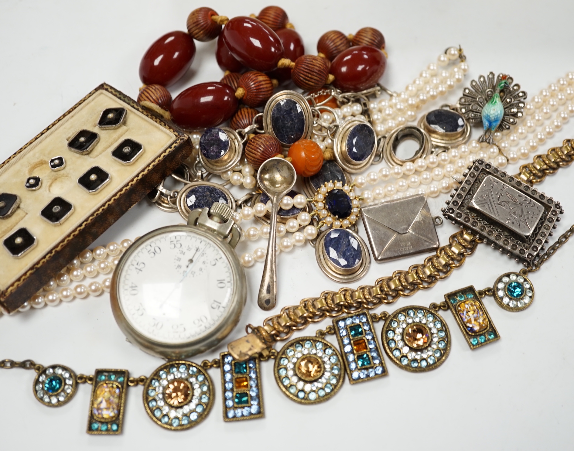 A small group of assorted costume jewellery, wrist and pocket watches and a silver envelope stamp case.